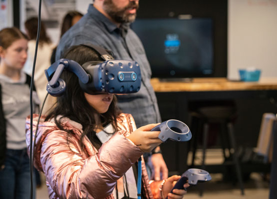 student wearing virtual reality goggles for construction